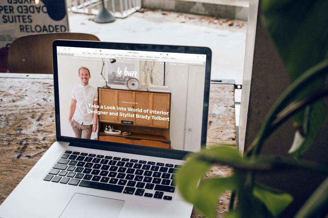 Open laptop on a wooden desk displaying a fully launched, responsive website, representing a newly published site synchronized with Google Business Profile.